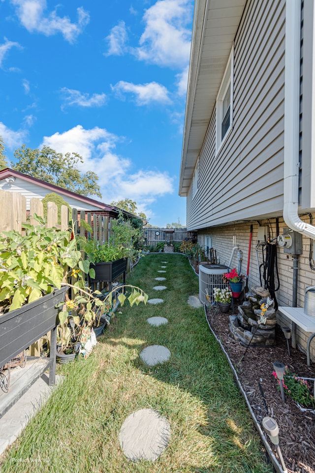 view of yard featuring central AC unit