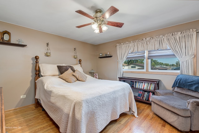 bedroom featuring ceiling fan and light hardwood / wood-style flooring