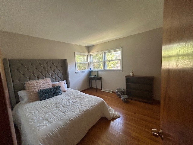 bedroom with hardwood / wood-style flooring