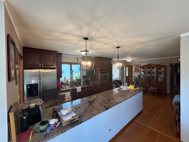 kitchen with a chandelier, hanging light fixtures, dark hardwood / wood-style floors, appliances with stainless steel finishes, and dark brown cabinetry