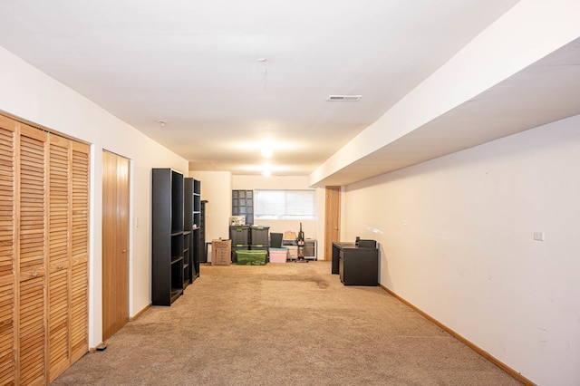 interior space featuring light carpet