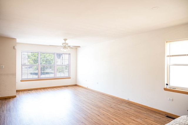 unfurnished room featuring ceiling fan and light hardwood / wood-style floors