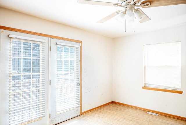 unfurnished room featuring ceiling fan and hardwood / wood-style floors