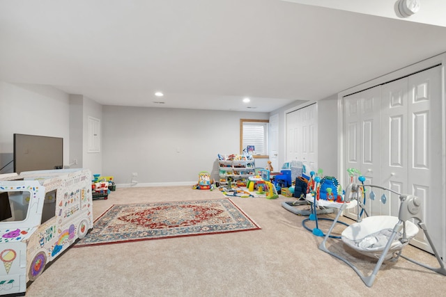 recreation room with carpet, baseboards, and recessed lighting