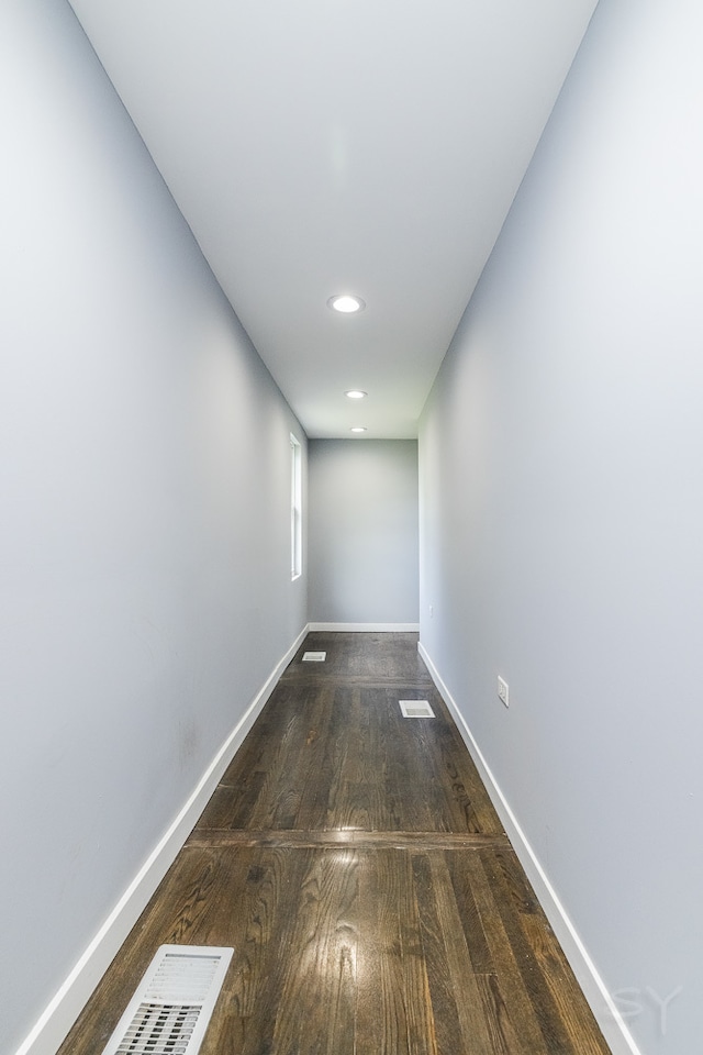 corridor featuring dark hardwood / wood-style floors