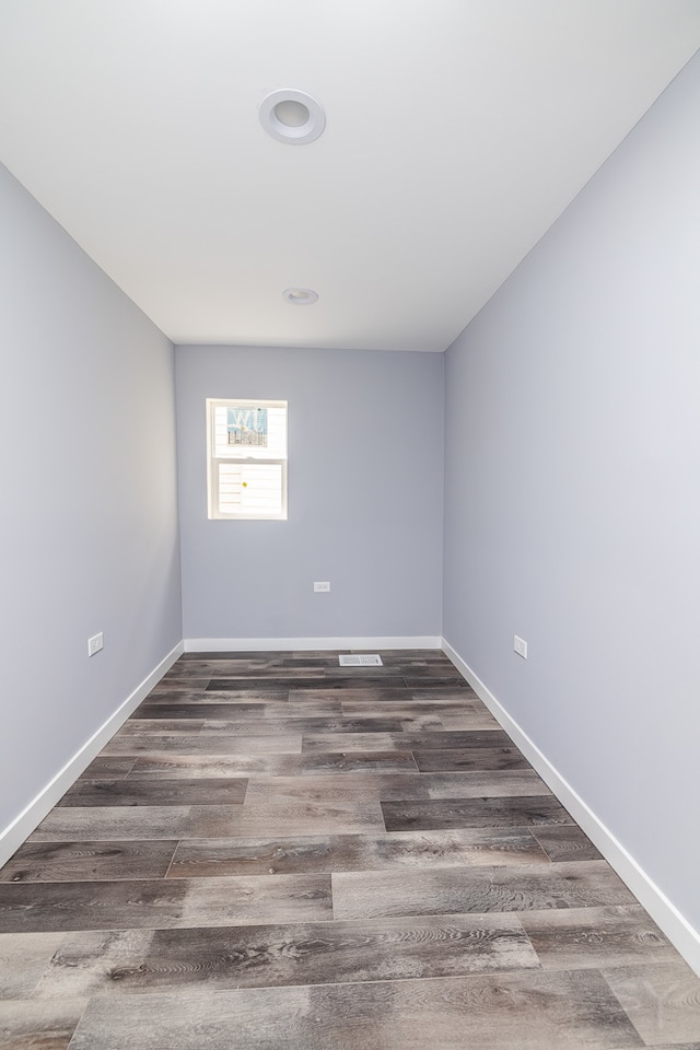 unfurnished room with hardwood / wood-style floors