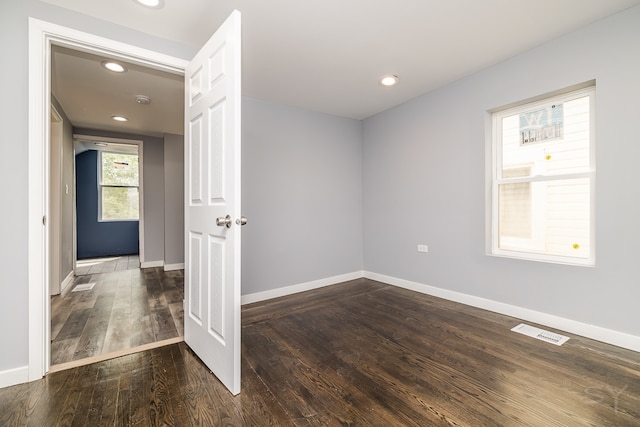 spare room featuring hardwood / wood-style flooring