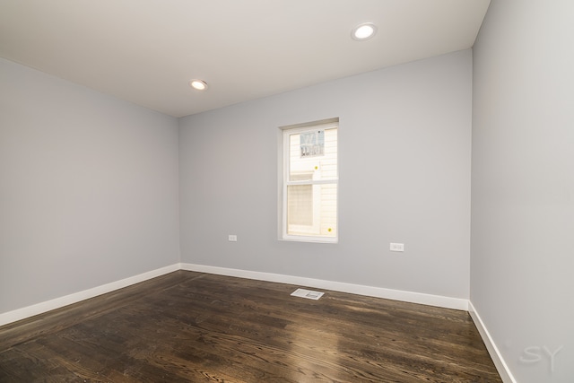 unfurnished room with hardwood / wood-style floors