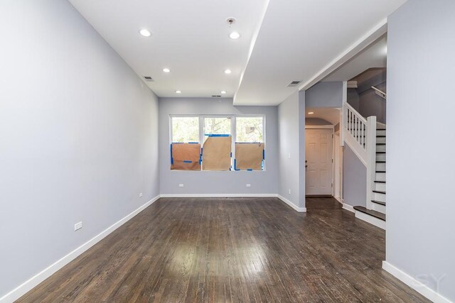 unfurnished living room with dark hardwood / wood-style floors