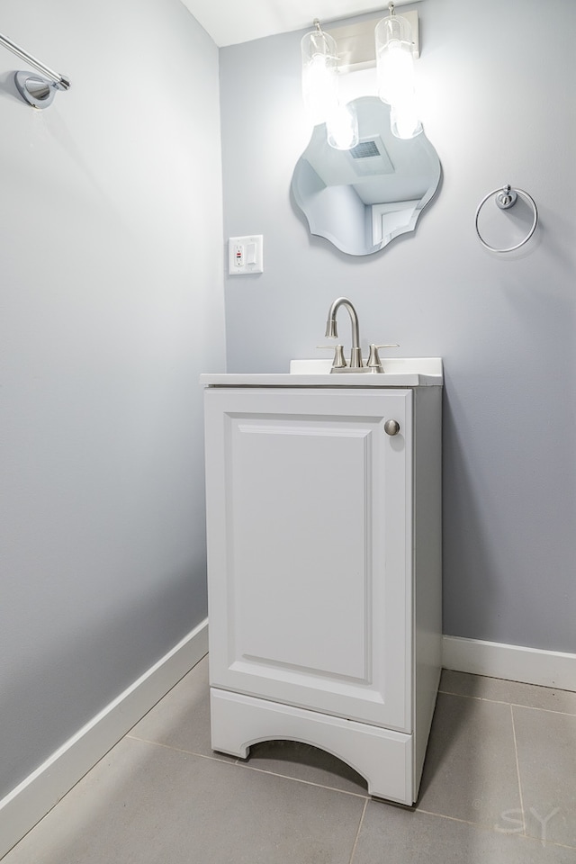 bathroom featuring tile patterned flooring and vanity