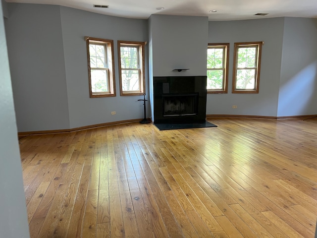 unfurnished living room featuring light hardwood / wood-style flooring