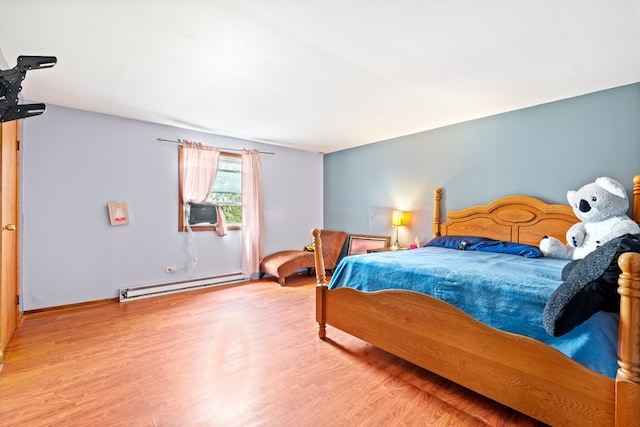 bedroom featuring a baseboard radiator, cooling unit, and wood-type flooring