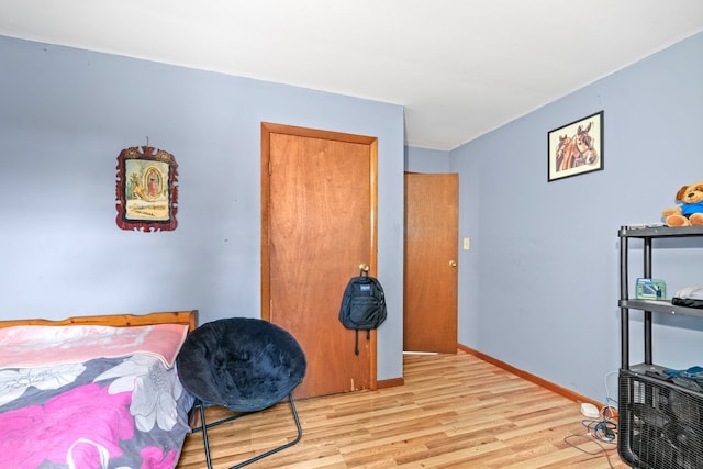 bedroom with light hardwood / wood-style flooring