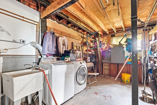 laundry room featuring sink and washer and clothes dryer