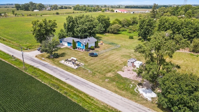 birds eye view of property with a rural view