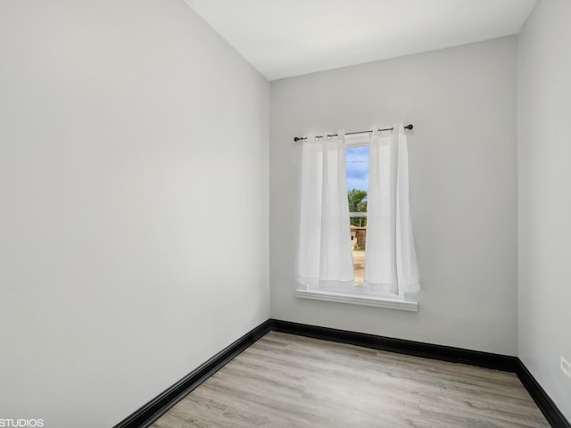 spare room featuring light wood-type flooring