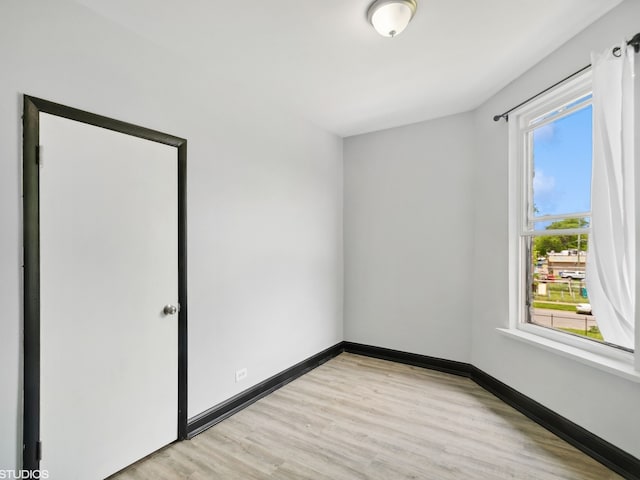 spare room featuring light hardwood / wood-style floors