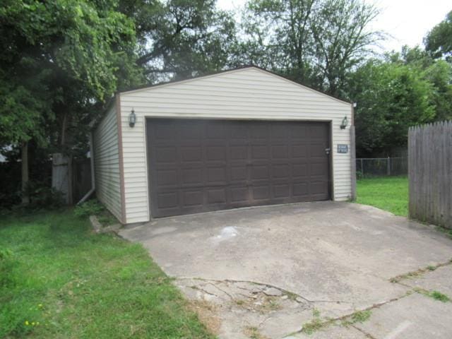 garage featuring a lawn