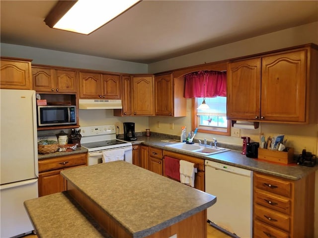 kitchen featuring white appliances and sink