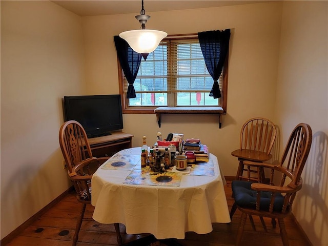 dining room with dark hardwood / wood-style flooring