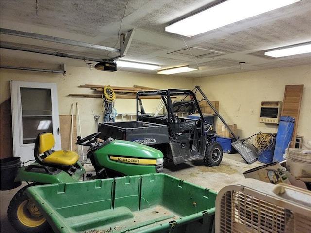 garage with a garage door opener and heating unit