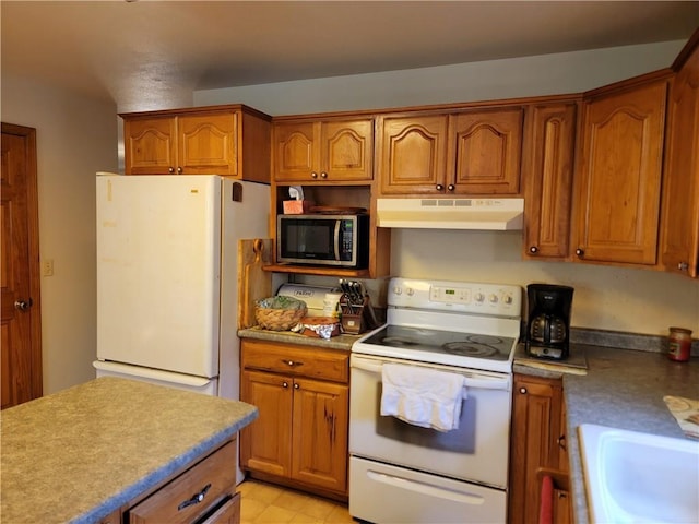 kitchen with sink and white appliances