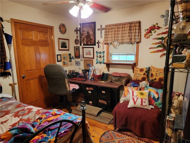 bedroom with hardwood / wood-style flooring and ceiling fan