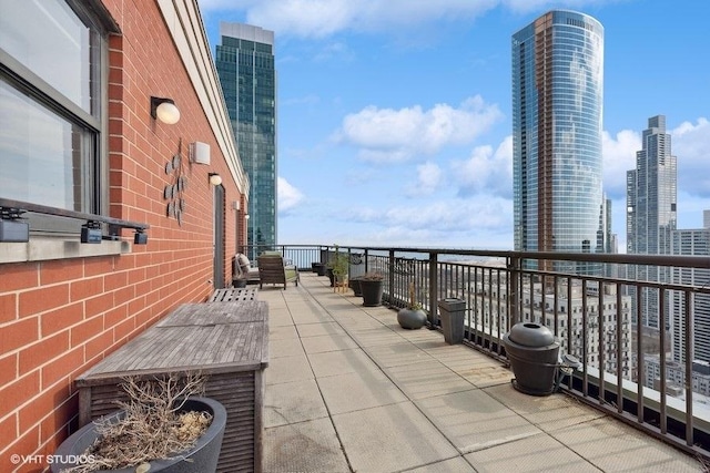 view of patio featuring a balcony