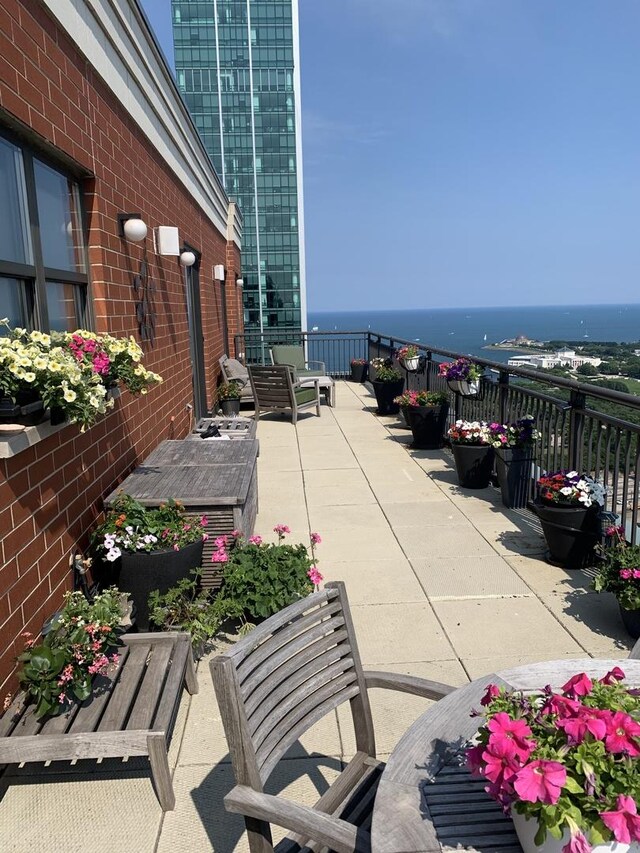 view of patio / terrace with a water view