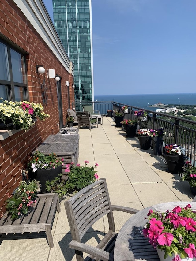 view of patio featuring a water view