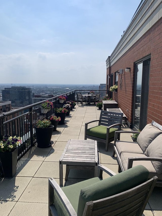 view of patio / terrace featuring an outdoor living space and a balcony