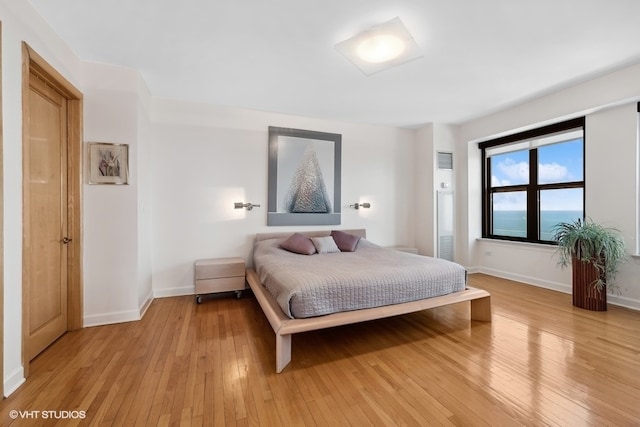 bedroom featuring light wood-type flooring