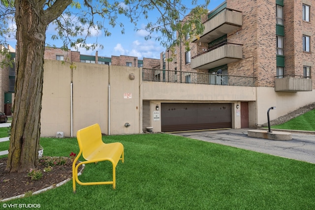 exterior space with a garage and a balcony