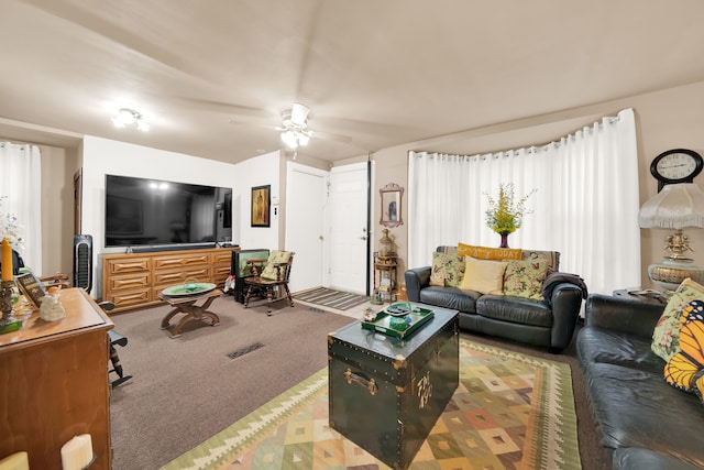 living room featuring carpet floors and ceiling fan