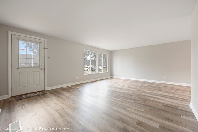 interior space with light hardwood / wood-style flooring and a healthy amount of sunlight