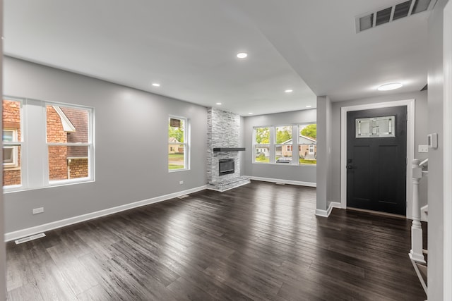 interior space with dark hardwood / wood-style floors and a fireplace