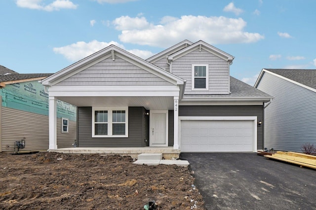 view of front of house with a garage and covered porch