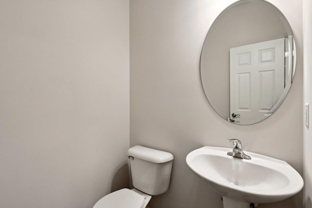 bathroom with sink and toilet