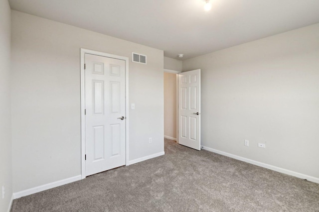 unfurnished bedroom featuring carpet flooring