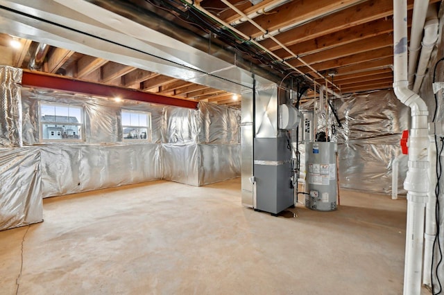 basement featuring heating unit and gas water heater