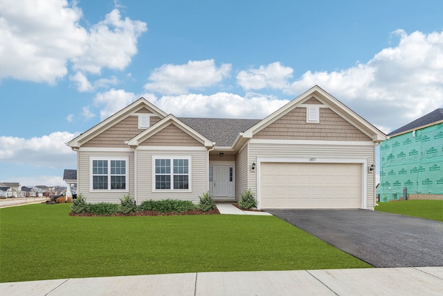 601 Virginia St, Elburn, IL 60119 - view of front of property featuring an attached garage and aphalt driveway
