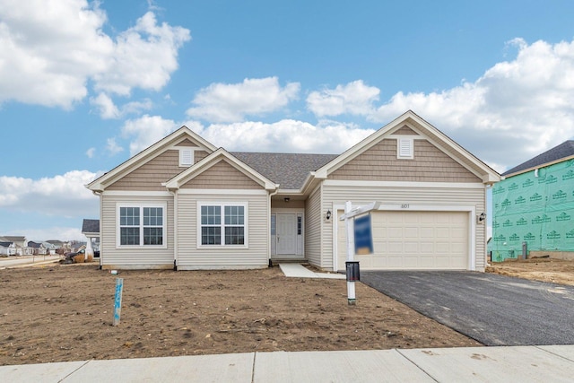 601 Virginia St, Elburn, IL 60119 - view of front facade featuring a garage and driveway