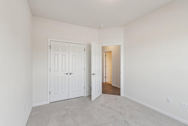 601 Virginia St, Elburn, IL 60119 - kitchen with light wood-type flooring, white cabinetry, appliances with stainless steel finishes, and a kitchen island