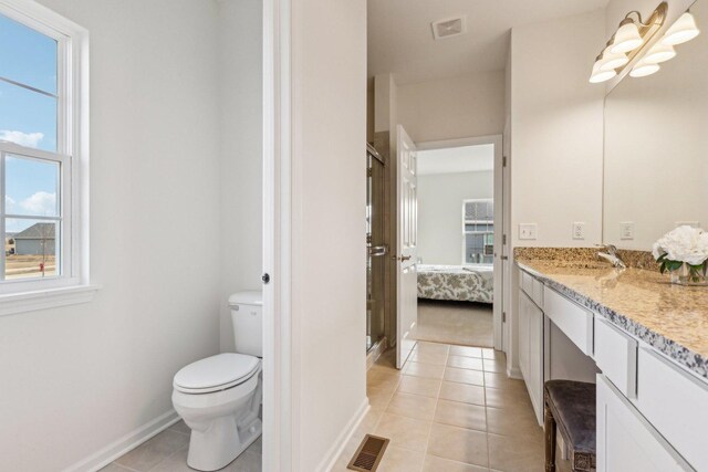601 Virginia St, Elburn, IL 60119 - bathroom with baseboards, a walk in closet, and vanity