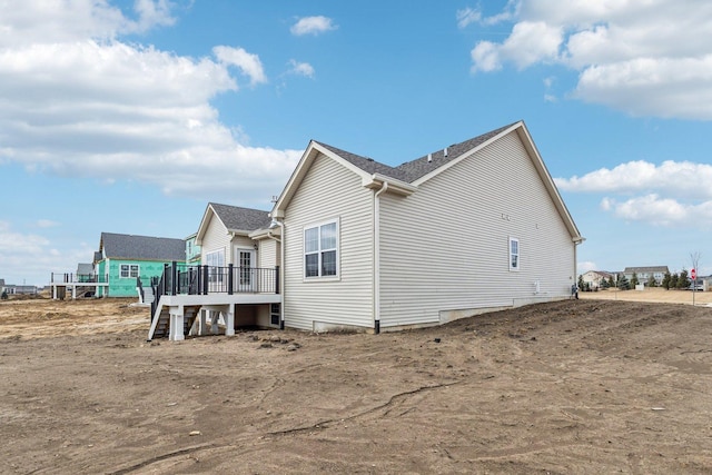 601 Virginia St, Elburn, IL 60119 - rear view of house with a shingled roof, stairway, and a deck