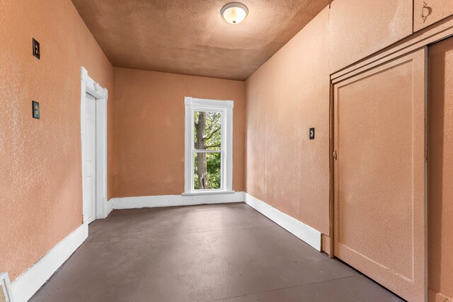 interior space with a textured ceiling