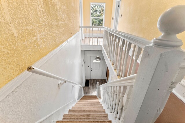 staircase featuring hardwood / wood-style floors