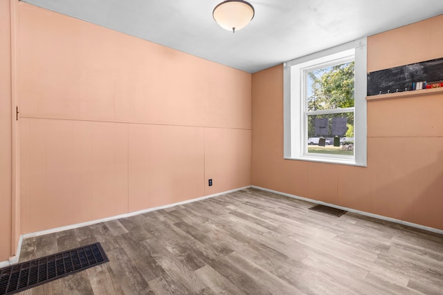 empty room with light hardwood / wood-style floors