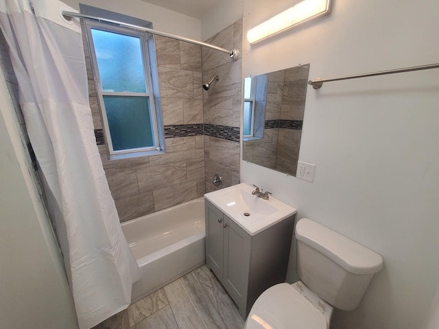 bathroom featuring shower / tub combo, toilet, and vanity