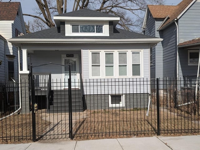 bungalow-style house with a front yard and a porch